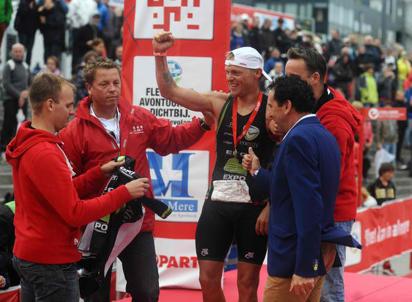 Bart Colpaert of Belgium celebrates winning the men's race during the Challenge Triathlon Almere-Amsterdam on September 14, 2013 in Almere, Netherlands.